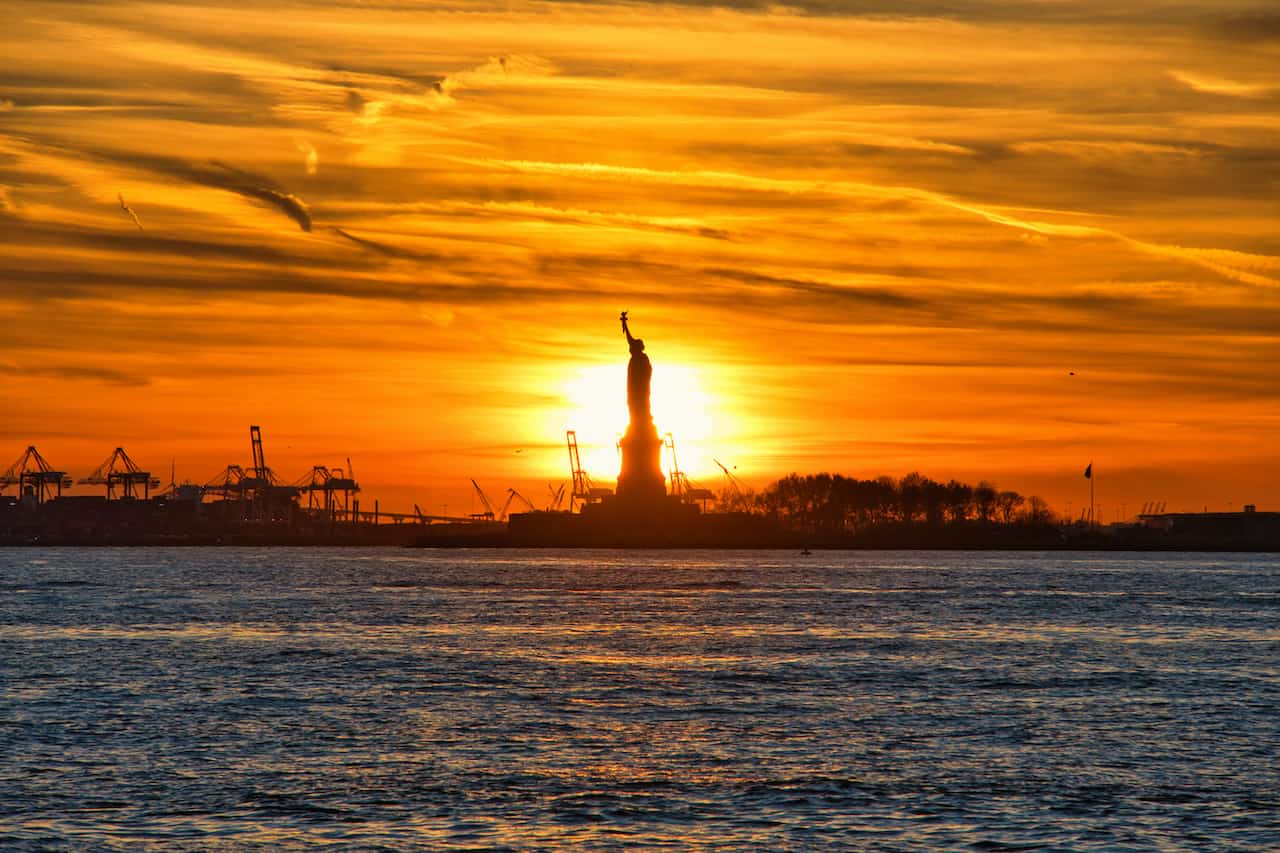 Sun Behind the Statue of Liberty